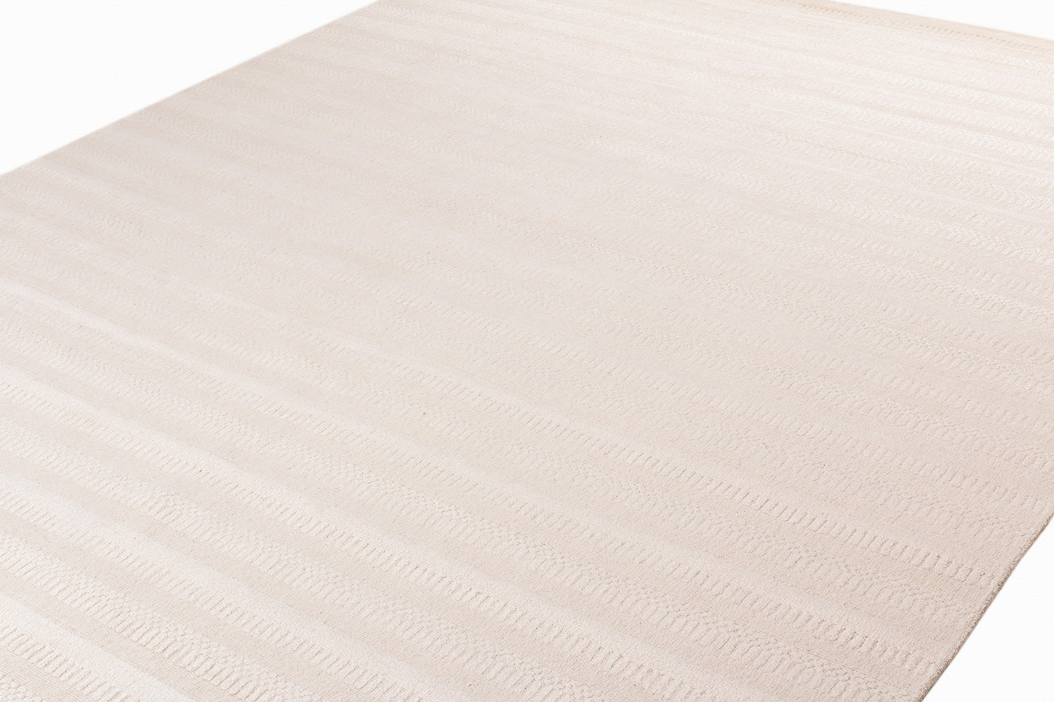 cream colored textured rug