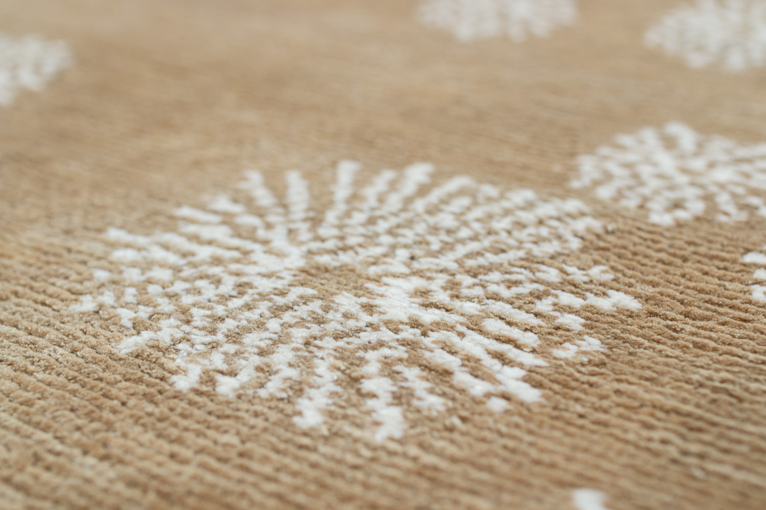 Close-up of a textured surface with white floral patterns