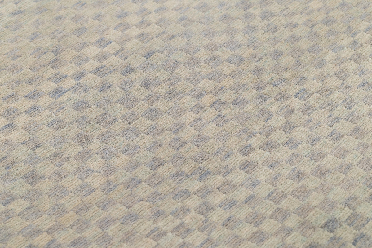 close up of textured light indigo checkerboard rug