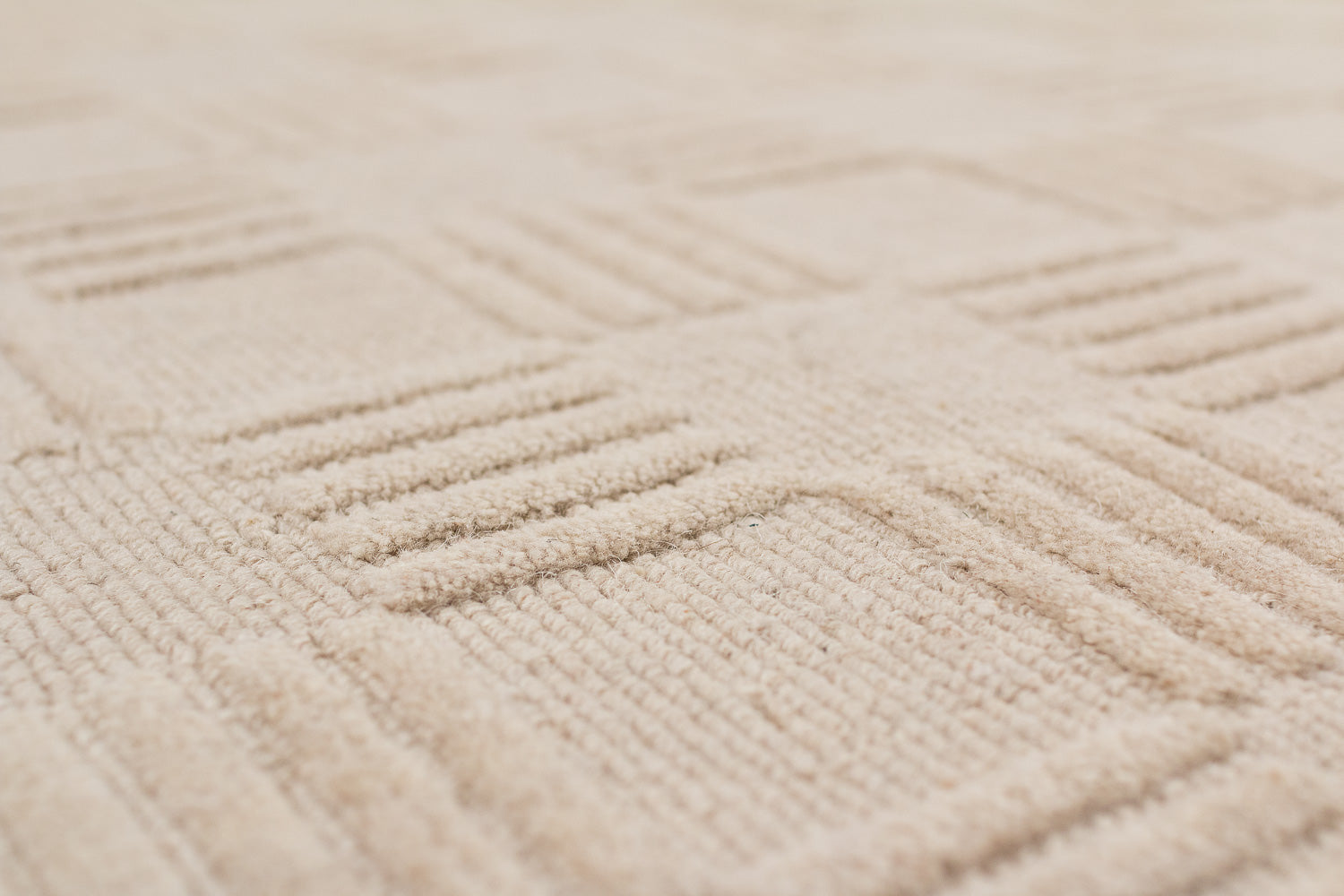 close up textured beige rug